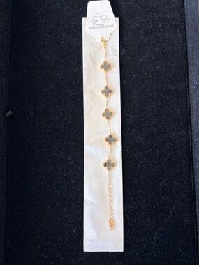 Gold Four-Leaf Clover Link Bracelet with Black Accents
